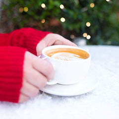 Barnie's Santa's White Christmas K-Cups capsule close-up reveals premium grounds for quality brews.