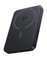 Baseus MagSafe portable charger attached to an iPhone for easy wireless charging on the go.