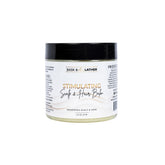 Bask & Lather Stimulating Scalp Balm jar close-up with cooling peppermint and nourishing oils.