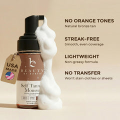 Beauty by Earth self tan mousse foam texture close-up for smooth coverage.