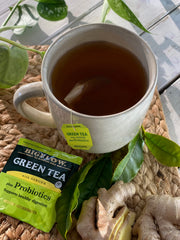 Close-up of Bigelow Green Tea with Ginger Plus Probiotics label shows probiotic blend.