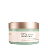 BIOSSANCE Squalane + Caffeine Toning Body Cream bottle close-up showing hydration-ready formula