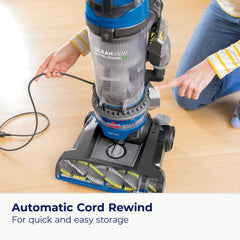 Bissell CleanView Swivel Rewind triple action brush roll in action on a rug.