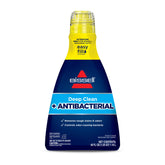 Bissell Deep Clean antibacterial formula bottle being poured for carpet stain treatment