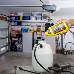 Spraying around baseboards with Black Flag Extreme in interior spaces.