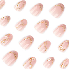 Bloazife full-cover glue-on nails with floral accents for quick glam looks.