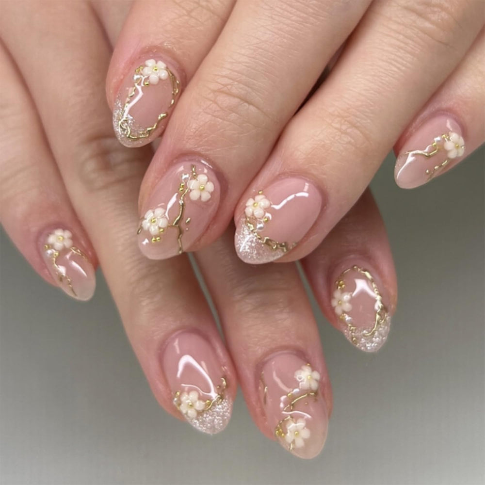 Bloazife nude pink flower press-on nails in almond shape for a quick, salon-like manicure.