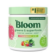 Bloom Nutrition greens and superfoods powder bottle ready for daily gut health routine.