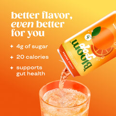 Close-up of Bloom Pop orange bottle label, vibrant flavor cue.