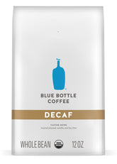 Blue Bottle Whole Bean Organic Decaf 12oz bag close-up, showcasing Swiss Water Process freshness.