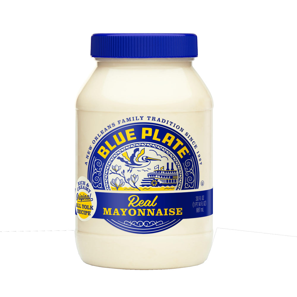 Blue Plate Real Mayonnaise being poured for a creamy sandwich