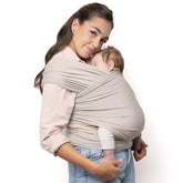 Boba Baby Wrap Carrier in beige fabric offering gentle newborn support.