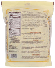 Dry mix of oats, raisins, almonds and walnuts displayed in a jar