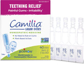 Boiron Camilia teething drops bottle with pre-measured doses ready.