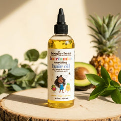Boogie and Bean Kids Hair Oil application on scalp supports healthy-looking shine.
