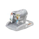 Bright Starts Learn-to-Sit seat front view shows cozy support for early sitting.