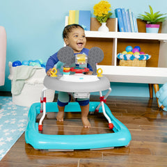 Bright Starts Mickey Mouse walker baby mirror encourages visual exploration.