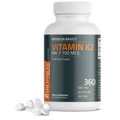 Bronson Vitamin K2 MK-7 bottle close-up showing 100 mcg per tablet for bone support.