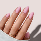 BTArtbox almond pastel baby pink short nails on hand for natural look and quick DIY.