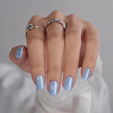 BTArtbox Ocean Glazed blue glossy nails on hand for a salon-like finish.