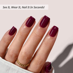 BTArtbox plum red squoval nails applying on hand