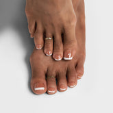 BTArtbox press-on toenails short white French tips closeup showing natural salon look