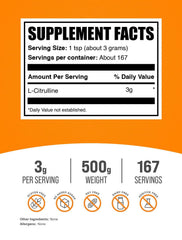 BulkSupplements L-Citrulline powder scoop beside measuring cup for dosage prep.