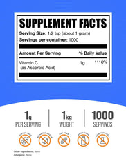 BulkSupplements Ascorbic Acid powder being scooped for precise 1 g serving.