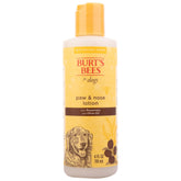 BURT'S BEES FOR PETS dog paw-nose lotion bottle moisturizes dry skin during grooming.