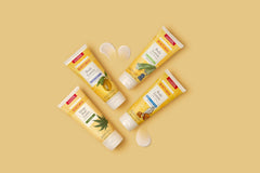 Hands applying Burt’s Bees Milk and Honey lotion for smooth, hydrated skin