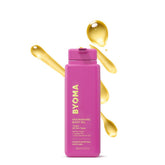 BYOMA Nourishing Body Oil bottle pouring for fast hydration and radiant skin.