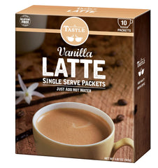 Café Tastlé vanilla latte glass highlighting smooth vanilla aroma.