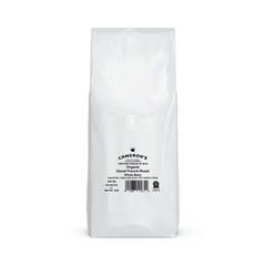 Cameron's Coffee Organic Decaf French Roast beans close-up showing rich aroma.