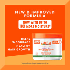 Cantu Argan Oil Leave-In Cream jar close-up showing rich formula for damaged hair care