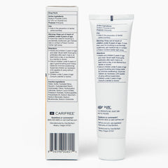 CariFree Gel 1100 citrus toothpaste being spread on a toothbrush for daily use.