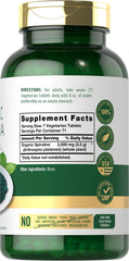 Carlyle Spirulina 3500mg tablets being poured for easy daily intake.