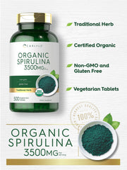 Carlyle Spirulina tablets closeup shows vibrant green color.