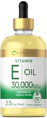 Carlyle Vitamin E Oil bottle with dropper for easy topical moisturization.