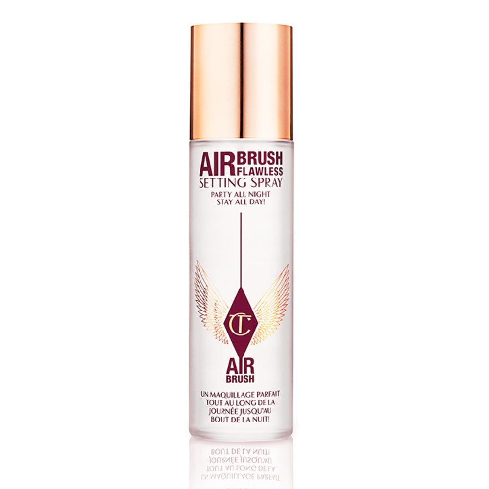 Charlotte Tilbury Airbrush Flawless Setting Spray bottle close-up showing sleek design and mist.