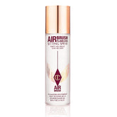 Charlotte Tilbury Airbrush Flawless Setting Spray bottle close-up showing sleek design and mist.