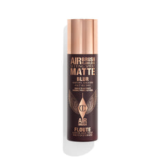 Charlotte Tilbury Airbrush Flawless Setting Spray bottle releasing an ultra-fine mist for priming makeup.