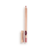 Charlotte Tilbury Lip Cheat Pillow Talk pencil closeup showing universal nude-pink shade for definition.
