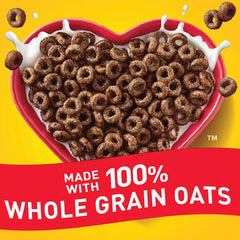 Cheerios Chocolate spoon-tasting a crunchy, chocolatey bite.