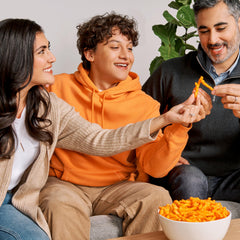 Cheetos cheddar jalapeño snack in hand for on-the-go craving relief