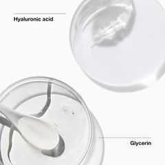 Hands applying Clinique All About Clean foam on the face for cleansing.