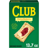 Club Crackers Extra Buttery box on table, ideal for quick snacking with friends.