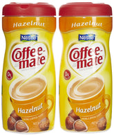 Coffee Mate hazelnut powdered creamer canister in a home setup, lactose-free and convenient flip-top.