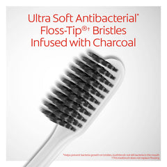 Colgate Gum Health Charcoal toothbrush cleaning along the gum line
