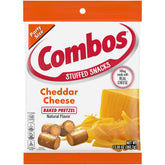 Combos Cheddar Cheese Baked Pretzel Snacks close-up shows a crunchy cheddar-filled bite.