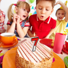 Conelist red white candle 7 brings vivid color to cake decor.